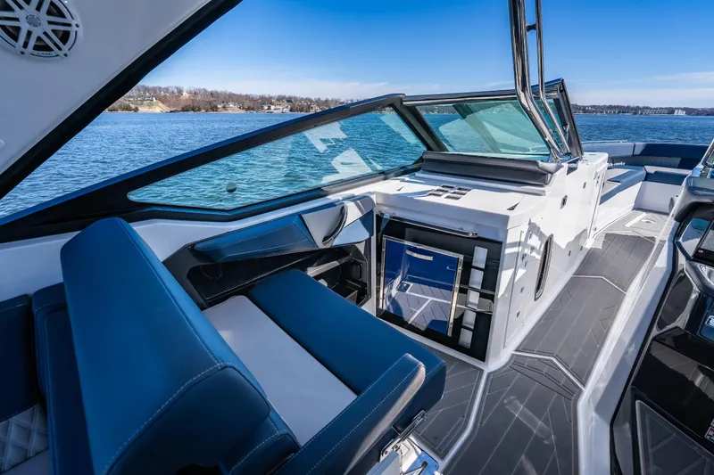 Slide: The Image of Luxurious interior of 2026 Monterey 378SS Super Sport boat on a serene lake. - 24