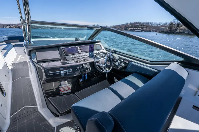 Slide: The Image of 2026 Monterey 378SS Super Sport boat interior with modern dashboard and steering wheel. - 26
