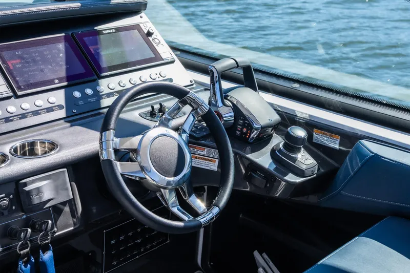 Slide: The Image of Cockpit of 2026 Monterey 378SS Super Sport boat with advanced controls and displays. - 27