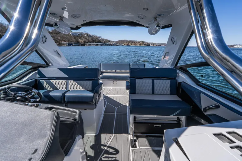 Slide: The Image of Luxurious interior of 2026 Monterey 378SS Super Sport boat on a serene lake. - 33