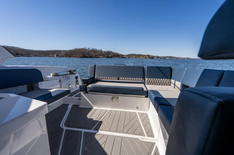 Slide: The Image of Luxurious seating on 2026 Monterey 378SS Super Sport boat with scenic lake view. - 38