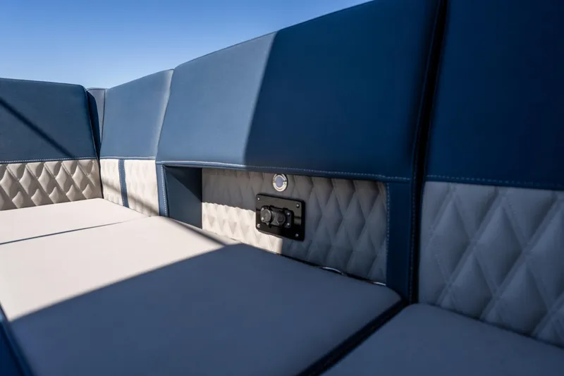 Slide: The Image of Luxurious seating on 2026 Monterey 378SS Super Sport boat, featuring blue and gray upholstery. - 39