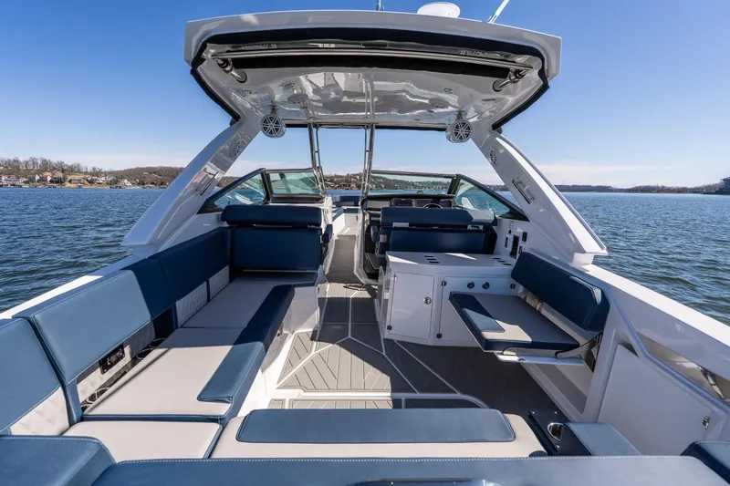 Slide: The Image of 2026 Monterey 378SS Super Sport boat interior with luxurious seating on a sunny day. - 40