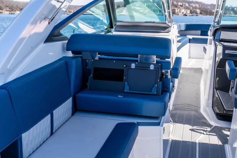 Slide: The Image of 2026 Monterey 378SS Super Sport boat interior with blue seating and modern design. - 43