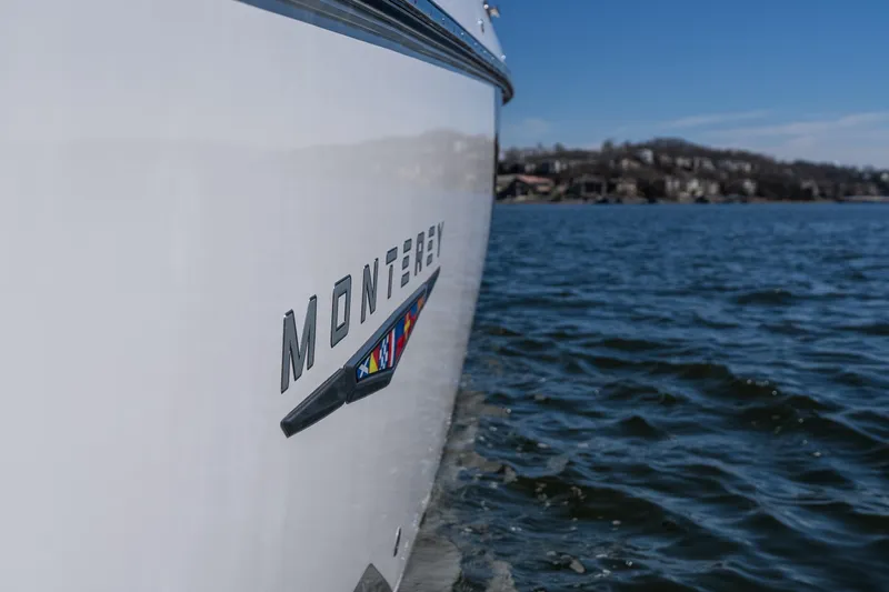Slide: The Image of 2026 Monterey 378SS Super Sport boat on water, showcasing sleek design and branding. - 44