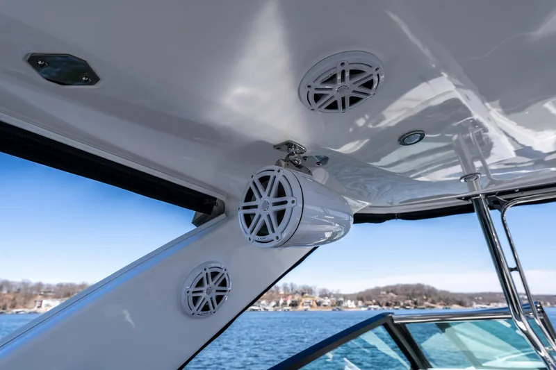 Slide: The Image of 2026 Monterey 378SS Super Sport boat speakers and canopy detail on a sunny day. - 45