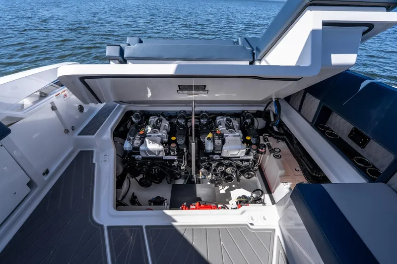 Slide: The Image of Engine compartment of 2026 Monterey 378SS Super Sport boat, open hatch, on water. - 46