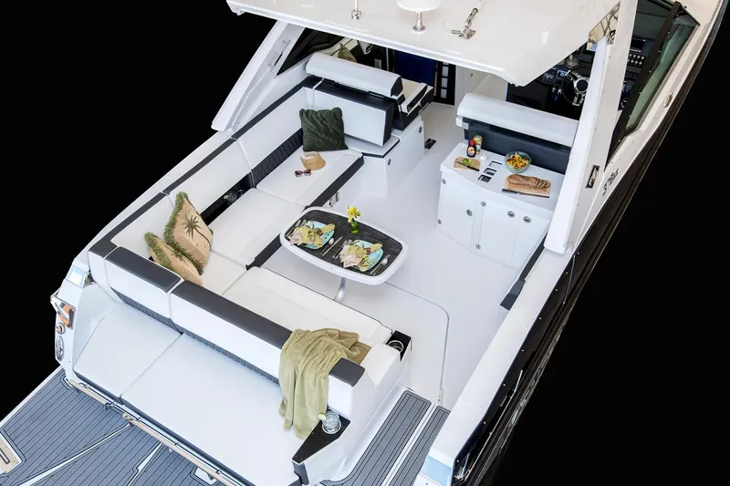 Slide: The Image of Manufacturer Provided Image: 2025 Monterey 378SS Super Sport boat interior with luxurious seating and dining area. - 5