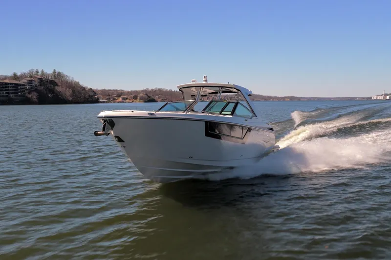 Slide: The Image of 2026 Monterey 378SS Super Sport cruising on a scenic lake under clear blue skies. - 54