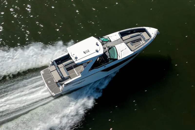 Slide: The Image of Aerial view of 2026 Monterey 378SS Super Sport boat cruising on water. - 58