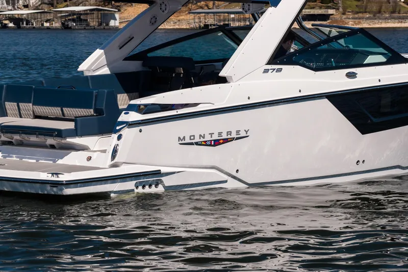 Slide: The Image of 2026 Monterey 378SS Super Sport boat on water, showcasing sleek design and luxury features. - 63