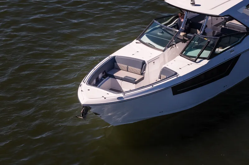 Slide: The Image of 2026 Monterey 378SS Super Sport boat cruising on calm water. - 64