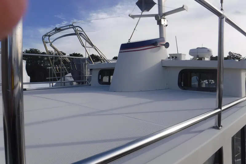 Slide: The Image of 2002 Nordic Tug 37 boat deck with railing and radar equipment. - 12