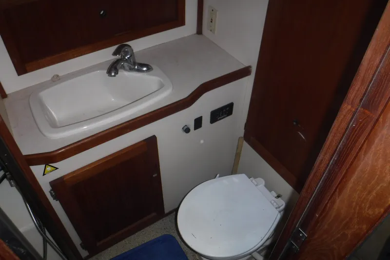 Slide: The Image of Bathroom interior of a 2002 Nordic Tug 37, featuring a sink and toilet. - 15