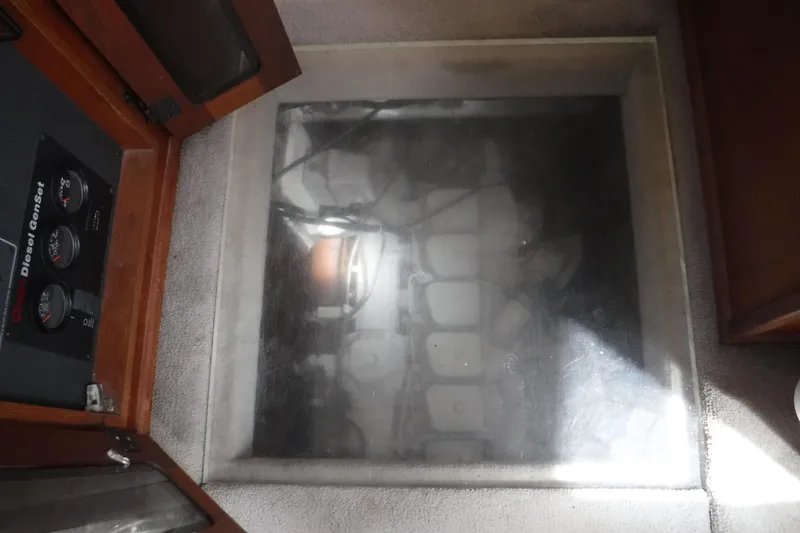 Slide: The Image of Engine room view of a 2002 Nordic Tug 37 with diesel generator controls. - 24