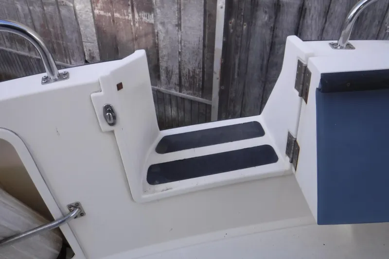 Slide: The Image of Nordic Tug 37 (2002) boat step detail with non-slip surface and railing. - 7