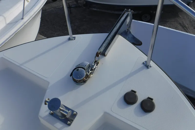 Slide: The Image of Bow of a 2002 Nordic Tug 37 with anchor and deck fittings. - 8
