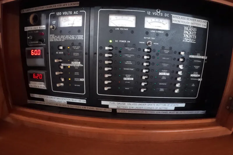 Slide: The Image of Electrical control panel of a 2005 Island Packet 370 yacht, showing AC and DC systems. - 14
