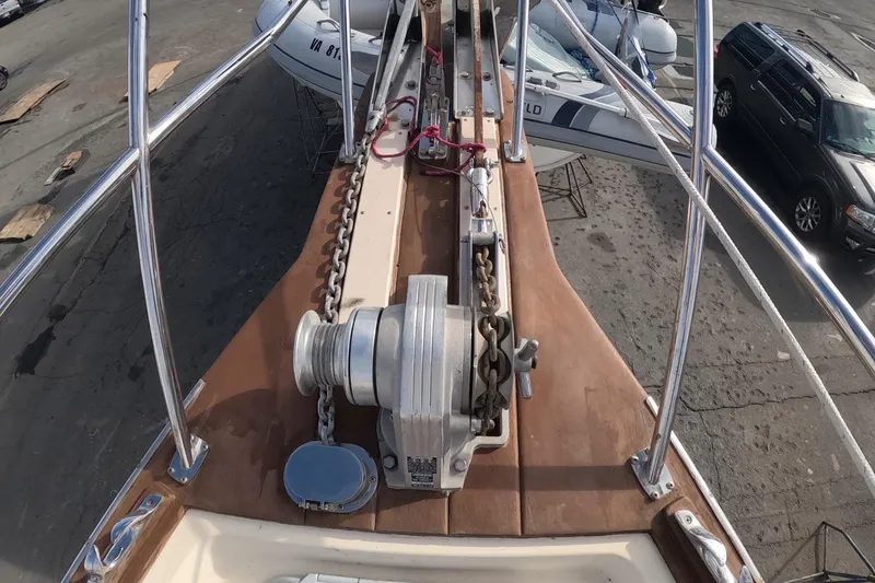 Slide: The Image of Bow of 2005 Island Packet 370 sailboat with anchor chain and winch. - 29