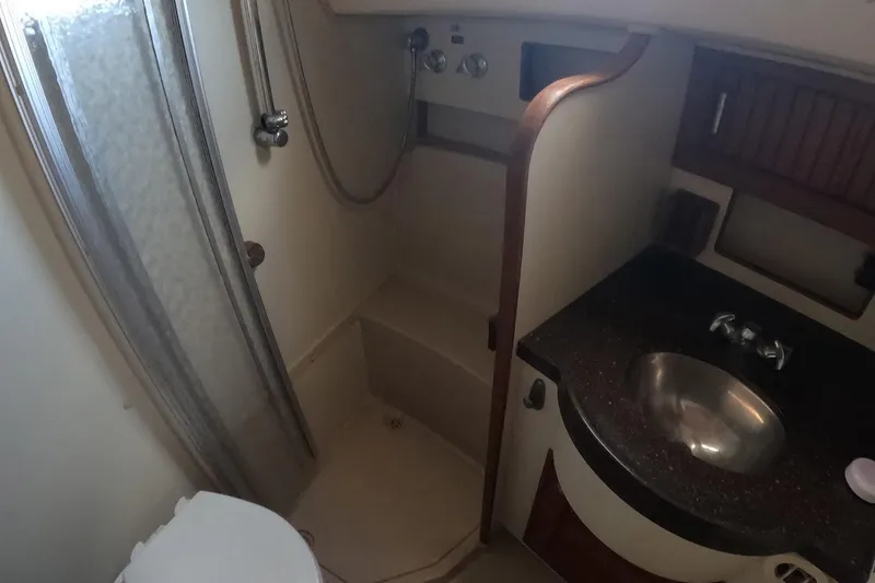Slide: The Image of 2005 Island Packet 370 yacht bathroom with shower, sink, and toilet. - 6