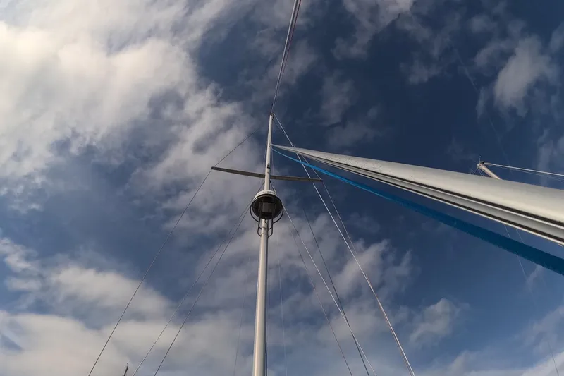 Slide: The Image of Mast of 2005 Island Packet 370 sailboat against a cloudy sky. - 30