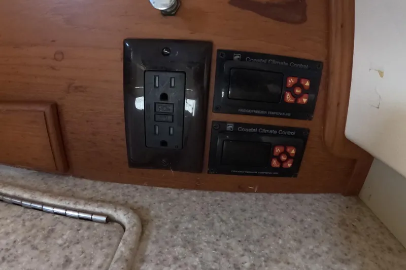 Slide: The Image of Electrical outlet and climate controls on 2005 Island Packet 370 yacht interior. - 15