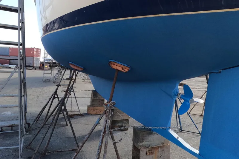 Slide: The Image of 2005 Island Packet 370 sailboat hull and propeller in dry dock. - 41