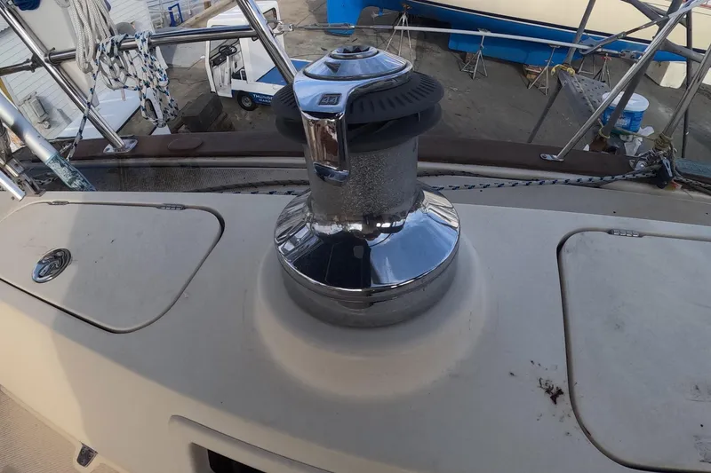 Slide: The Image of 2005 Island Packet 370 sailboat deck with winch and rigging details. - 19
