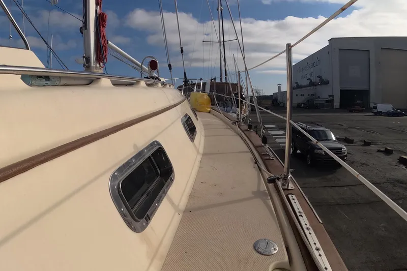Slide: The Image of 2005 Island Packet 370 sailboat docked at Thunderbolt Marine shipyard. - 28