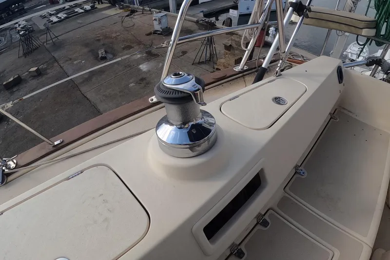 Slide: The Image of 2005 Island Packet 370 sailboat deck with winch and storage compartments. - 18