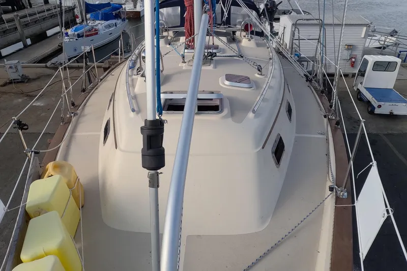 Slide: The Image of 2005 Island Packet 370 sailboat docked at marina, view of deck and rigging. - 35