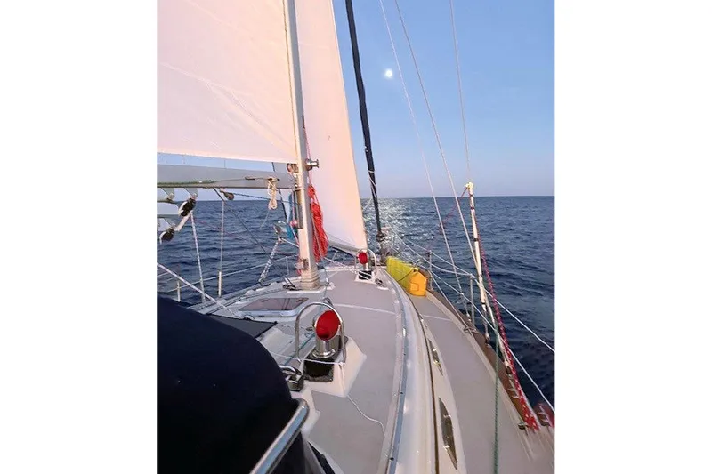 Slide: The Image of Sailing on a 2005 Island Packet 370 yacht under clear skies. - 42