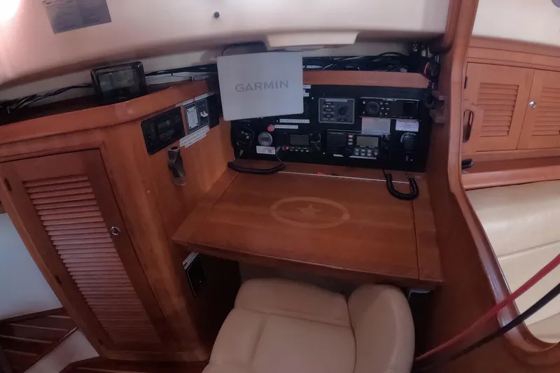 Slide: The Image of Navigation station of 2005 Island Packet 370 sailboat with Garmin equipment. - 13