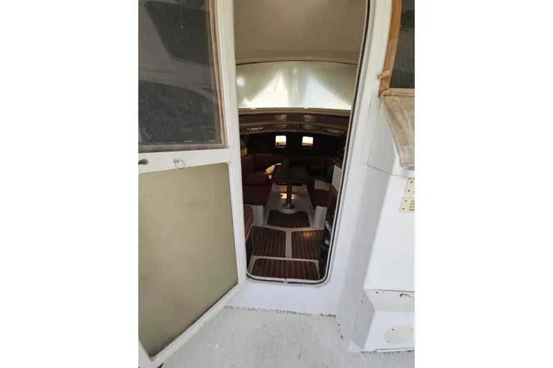 Slide: The Image of Interior view of 2005 Gemini MC 105 sailboat, showcasing cabin entrance and seating area. - 26