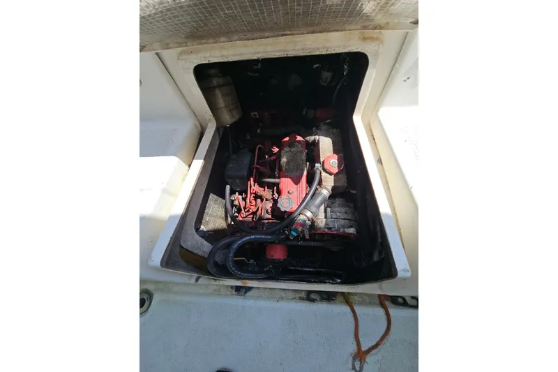 Slide: The Image of Engine compartment of a 2005 Gemini MC 105 boat, featuring visible mechanical components. - 27