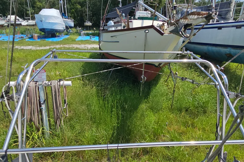 Slide: The Image of Boats in a grassy yard, featuring a 2005 Gemini MC 105 sailboat. - 32