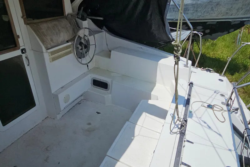 Slide: The Image of Cockpit of a 2005 Gemini MC 105 sailboat with steering wheel and rigging. - 34
