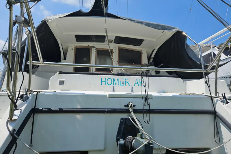 Slide: The Image of Sailboat Gemini MC 105, 2005 model, docked with visible cockpit and equipment. - 36