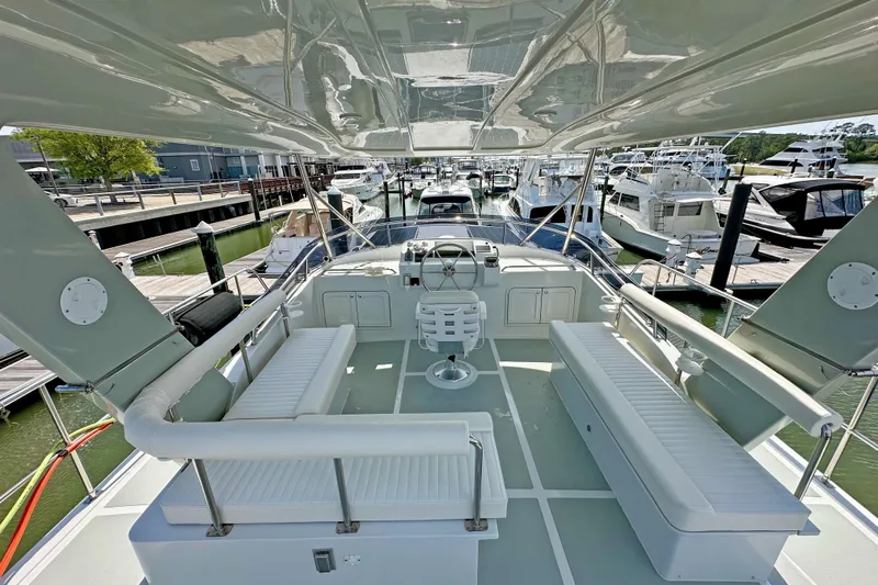 Slide: The Image of 2025 Helmsman Trawlers 43E Pilothouse - Flybridge Seating / Helm Station - 14