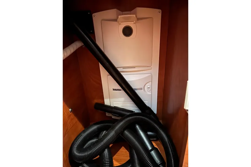 Slide: The Image of Built-in vacuum system inside 2008 Rinker 400 Express Cruiser yacht. - 19