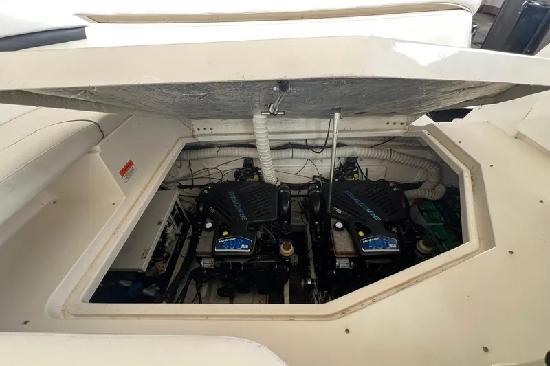 Slide: The Image of 2008 Rinker 400 Express Cruiser engine compartment with dual MerCruiser engines. - 21