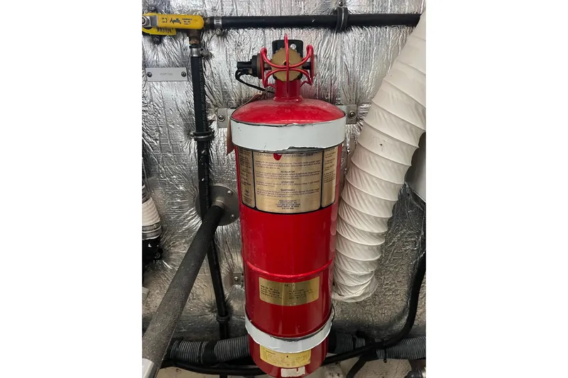 Slide: The Image of Red fire extinguisher in 2008 Rinker 400 Express Cruiser engine room. - 22