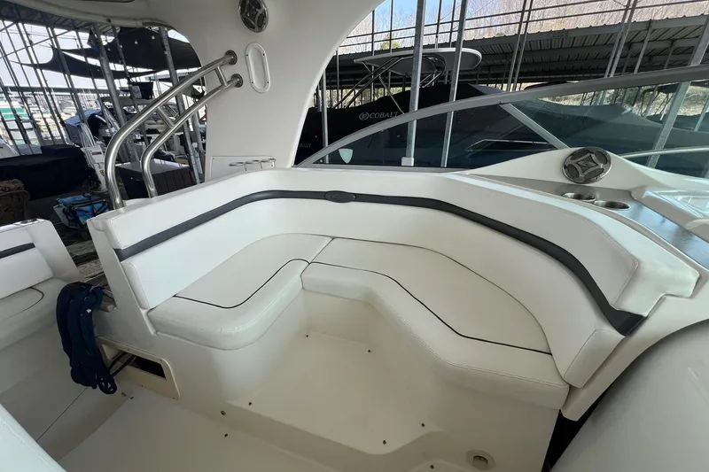 Slide: The Image of 2008 Rinker 400 Express Cruiser interior with white seating and stainless steel accents. - 6