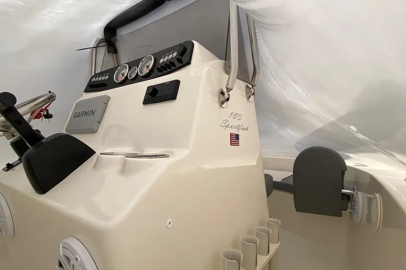 Slide: The Image of 2026 Pioneer 180 Sportfish boat dashboard with Garmin navigation system and control panel. - 10