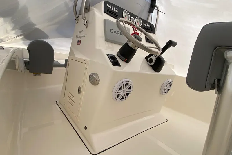 Slide: The Image of 2026 Pioneer 180 Sportfish boat console with steering wheel and controls. - 5