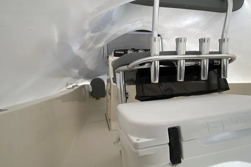 Slide: The Image of Interior of 2026 Pioneer 180 Sportfish boat with rod holders and seating. - 8