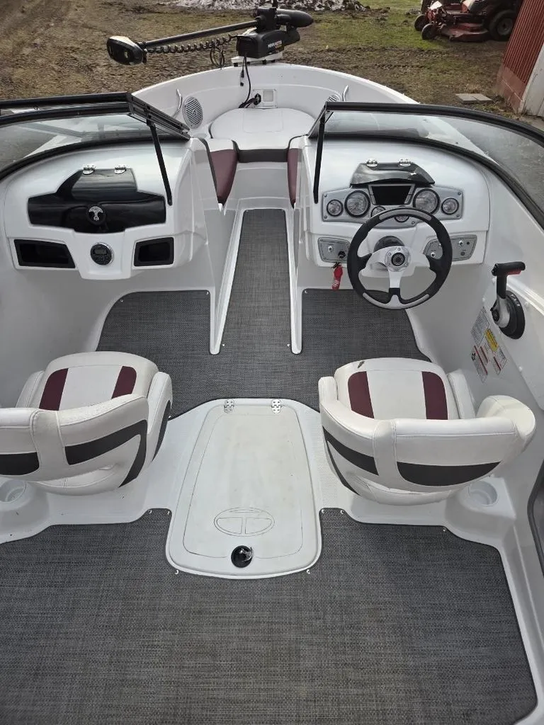 Slide: The Image of Interior of a 2019 Tahoe 550 TF boat with steering console. - 5