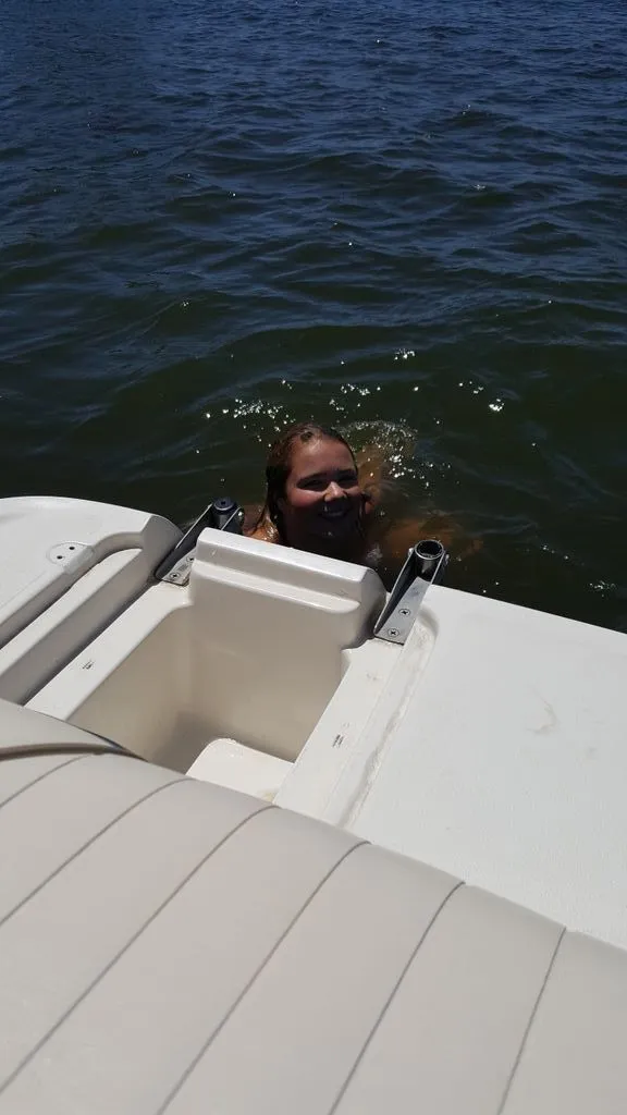 Slide: The Image of Person swimming beside a 2019 Tahoe 500 TS boat. - 3