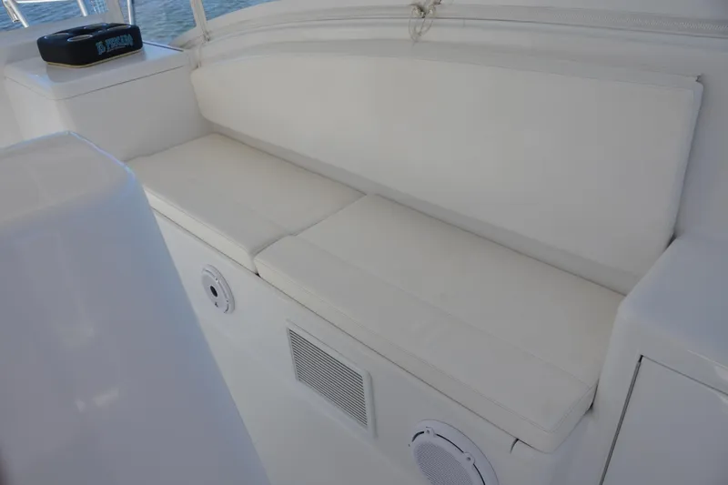 Slide: The Image of White cushioned seating on 2006 Custom Carolina Heritage Express boat. - 12