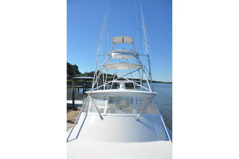 Slide: The Image of 2006 Custom Carolina Heritage Express boat docked on a sunny day. - 22